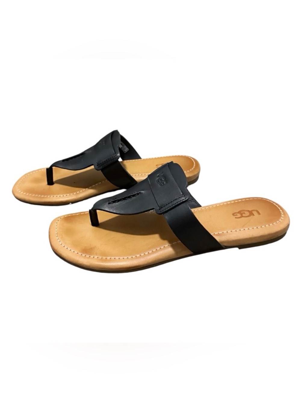 UGG Gaila women’s 6.5 black leather thong sandals with a logo on the strap